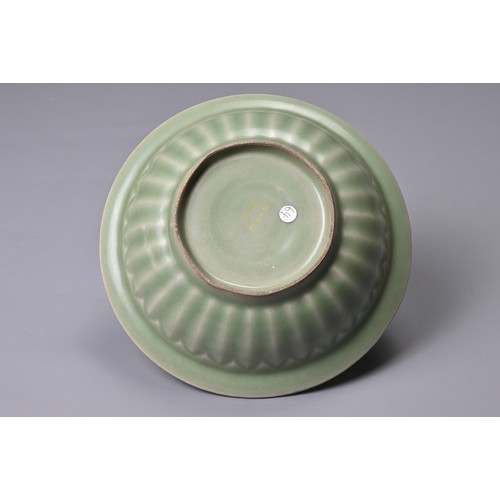 69 - A CHINESE LONGQUAN CELADON TWIN FISH PORCELAIN DISH. Fish well detailed and applied in high relief s... 