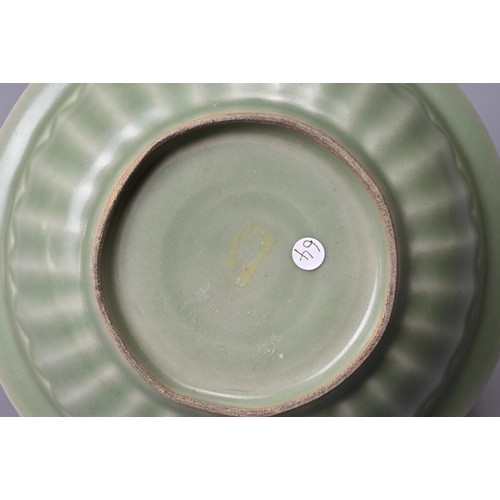 69 - A CHINESE LONGQUAN CELADON TWIN FISH PORCELAIN DISH. Fish well detailed and applied in high relief s... 