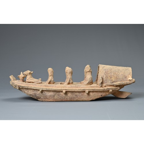 208 - A CHINESE POTTERY MODEL OF A BOAT WITH RUDDER, HAN DYNASTY STYLE. Close examples are known found in ... 