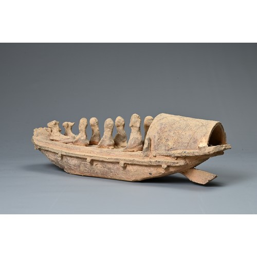 208 - A CHINESE POTTERY MODEL OF A BOAT WITH RUDDER, HAN DYNASTY STYLE. Close examples are known found in ... 