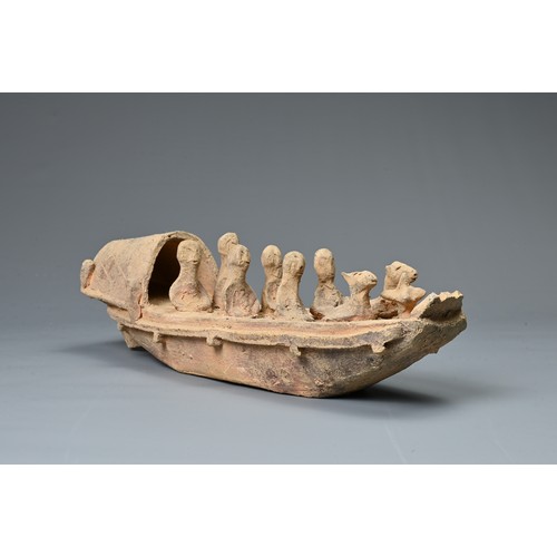208 - A CHINESE POTTERY MODEL OF A BOAT WITH RUDDER, HAN DYNASTY STYLE. Close examples are known found in ... 