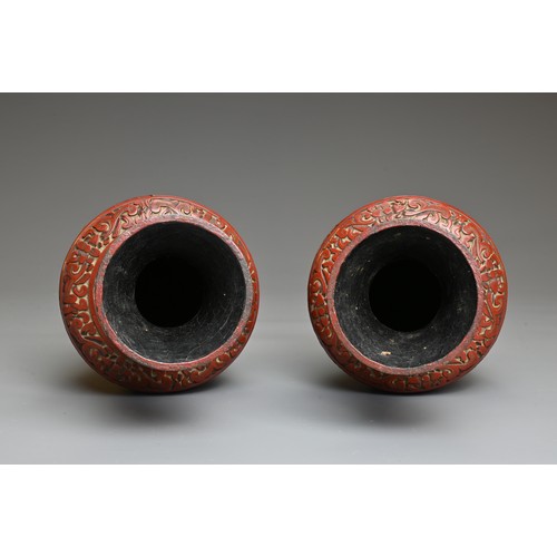 4 - A PAIR OF CHINESE CINNABAR LACQUER VASES, QING DYNASTY. Each of baluster form carved in relief with ... 