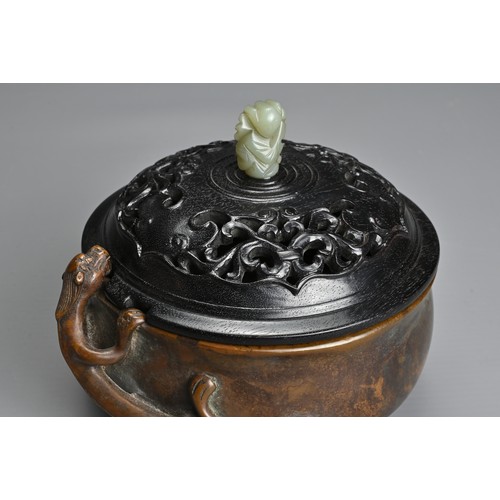 6 - A CHINESE BRONZE CENSER. Heavily cast of rounded form with figure of chilong and two character mark ... 