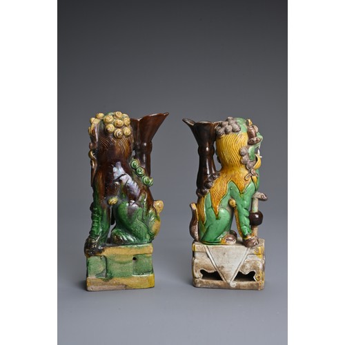 10 - TWO CHINESE SANCAI GLAZED POTTERY JOSS STICK HOLDERS, QING DYNASTY. Buddhistic lions modelled seated... 