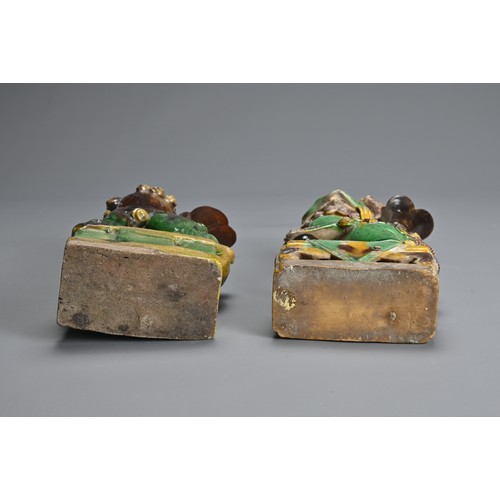 10 - TWO CHINESE SANCAI GLAZED POTTERY JOSS STICK HOLDERS, QING DYNASTY. Buddhistic lions modelled seated... 