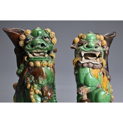 10 - TWO CHINESE SANCAI GLAZED POTTERY JOSS STICK HOLDERS, QING DYNASTY. Buddhistic lions modelled seated... 