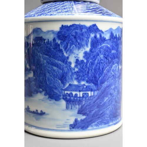 13 - A CHINESE BLUE AND WHITE PORCELAIN TEA CADDY, 20TH CENTURY. Finely decorated with a landscape scene ... 