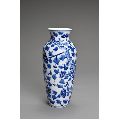 14 - A CHINESE BLUE AND WHITE PORCELAIN VASE. Decorated with a dragon and leafy peony scrolls with flat u... 