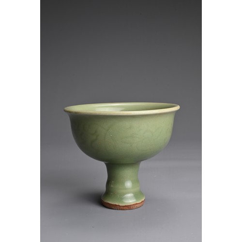 19 - A CHINESE LONGQUAN CELADON GLAZED STEM BOWL. Heavily potted with a deep, rounded bowl carved with st... 