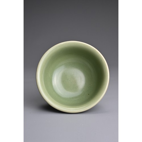 19 - A CHINESE LONGQUAN CELADON GLAZED STEM BOWL. Heavily potted with a deep, rounded bowl carved with st... 