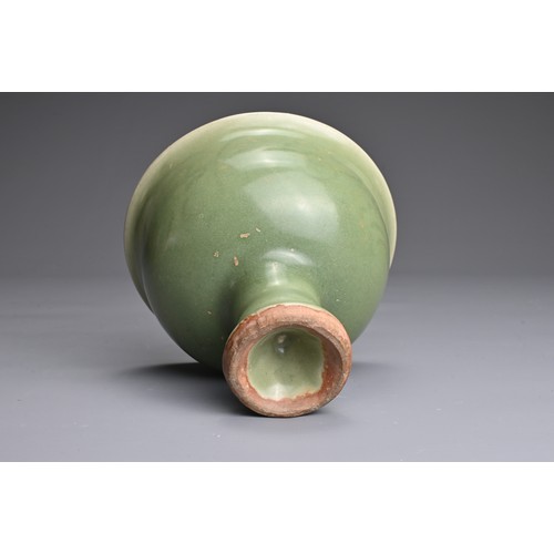 19 - A CHINESE LONGQUAN CELADON GLAZED STEM BOWL. Heavily potted with a deep, rounded bowl carved with st... 