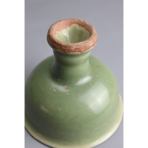 19 - A CHINESE LONGQUAN CELADON GLAZED STEM BOWL. Heavily potted with a deep, rounded bowl carved with st... 