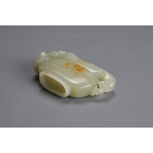 26 - A CHINESE CARVED PALE CELADON JADE CUP. Pale celadon colour with russet patches, featuring a boy han... 