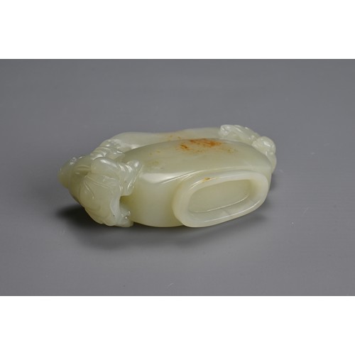 26 - A CHINESE CARVED PALE CELADON JADE CUP. Pale celadon colour with russet patches, featuring a boy han... 