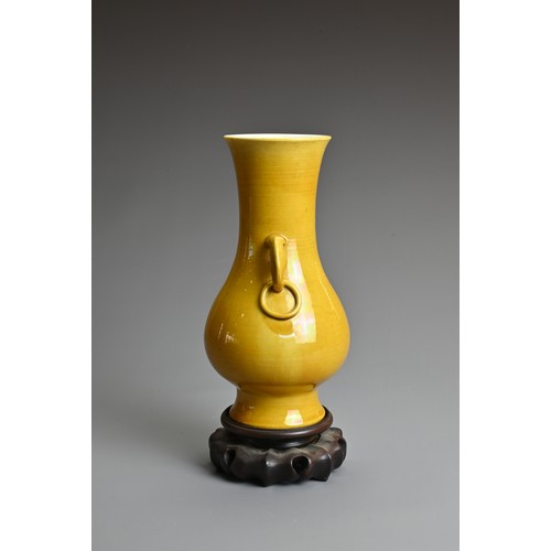 32 - A CHINESE YELLOW GLAZED PORCELAIN VASE, LATE QING DYNASTY. Of baluster form covered in a with M form... 