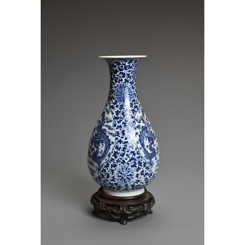 33 - A CHINESE BLUE AND WHITE PORCELAIN, LATE QING DYNASTY. Of pear shape decorated with dragons chasing ... 