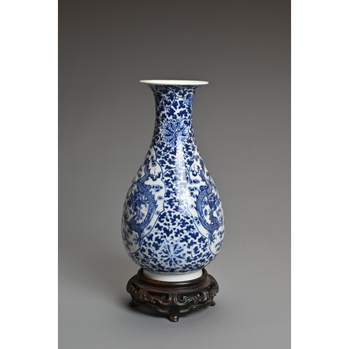 33 - A CHINESE BLUE AND WHITE PORCELAIN, LATE QING DYNASTY. Of pear shape decorated with dragons chasing ... 