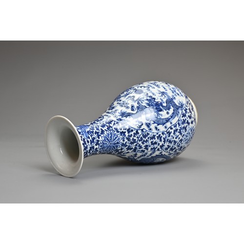 33 - A CHINESE BLUE AND WHITE PORCELAIN, LATE QING DYNASTY. Of pear shape decorated with dragons chasing ... 