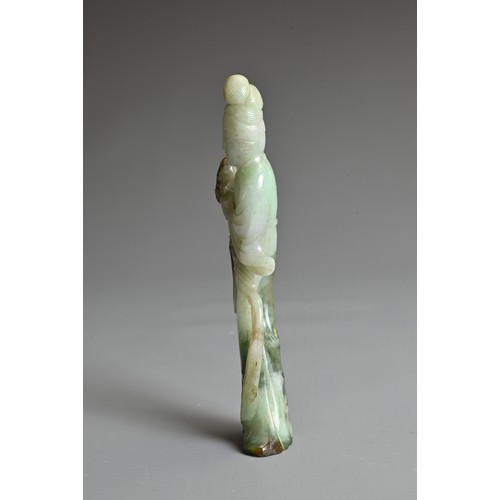 45 - A CHINESE CARVED JADE FIGURE OF GUANYIN, QING DYNASTY. The figure standing dressed in robes holding ... 