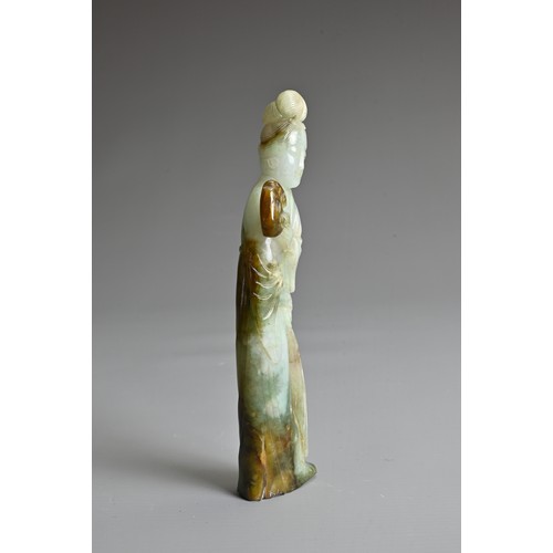 45 - A CHINESE CARVED JADE FIGURE OF GUANYIN, QING DYNASTY. The figure standing dressed in robes holding ... 