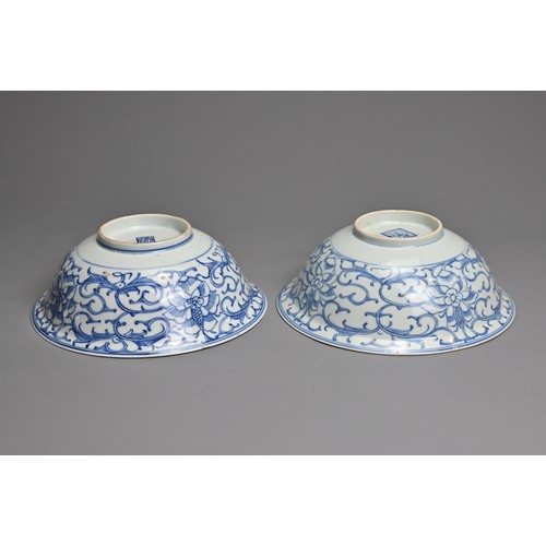 9 - TWO CHINESE BLUE AND WHITE PORCELAIN BOWLS, 19TH CENTURY. Rounded bowls with everted rims decorated ... 