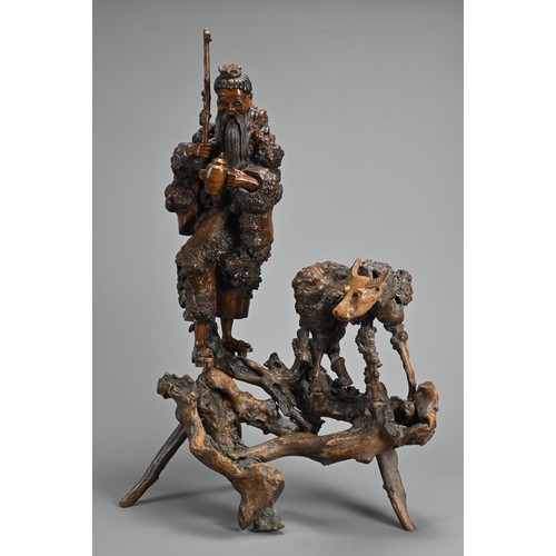 54 - TWO VERY LARGE CHINESE ROOT CARVINGS, 19TH CENTURY. Sectional figures on stands of immortals and buf... 