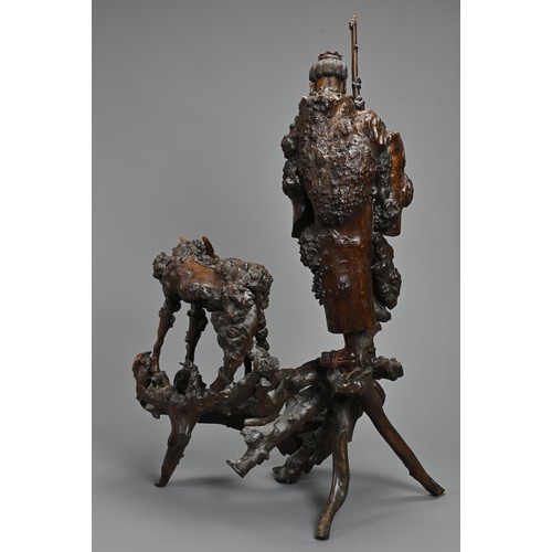 54 - TWO VERY LARGE CHINESE ROOT CARVINGS, 19TH CENTURY. Sectional figures on stands of immortals and buf... 