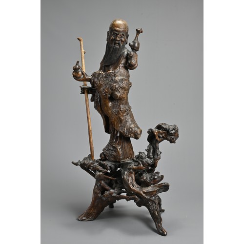 54 - TWO VERY LARGE CHINESE ROOT CARVINGS, 19TH CENTURY. Sectional figures on stands of immortals and buf... 