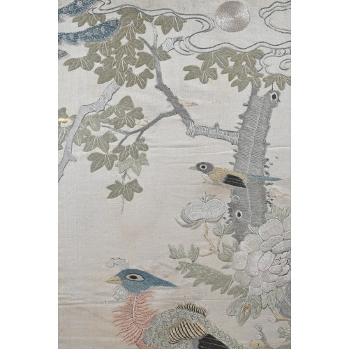 59 - A CHINESE QING DYNASTY EMBROIDERED SILK PANEL. Of rectangular form, depicting a phoenix perched on r... 