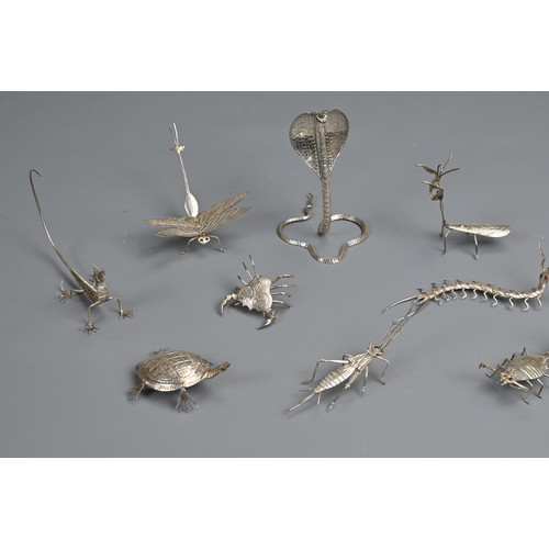 61 - A SET OF TWELVE INDIAN WHITE METAL INSECT AND REPTILE MENU HOLDERS, EARLY 20TH CENTURY. Each differe... 