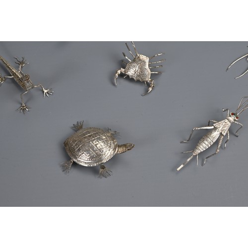 61 - A SET OF TWELVE INDIAN WHITE METAL INSECT AND REPTILE MENU HOLDERS, EARLY 20TH CENTURY. Each differe... 