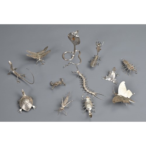 61 - A SET OF TWELVE INDIAN WHITE METAL INSECT AND REPTILE MENU HOLDERS, EARLY 20TH CENTURY. Each differe... 