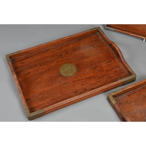 56 - THREE CHINESE WOOD TRAYS, EARLY 20TH CENTURY. To include a rectangular tray with metal dragons and x... 