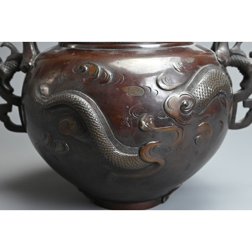 302 - A JAPANESE MEIJI PERIOD (1868-1912) BRONZE TWO-HANDLED GLOBULAR VASE. Decorated in high relief with ... 