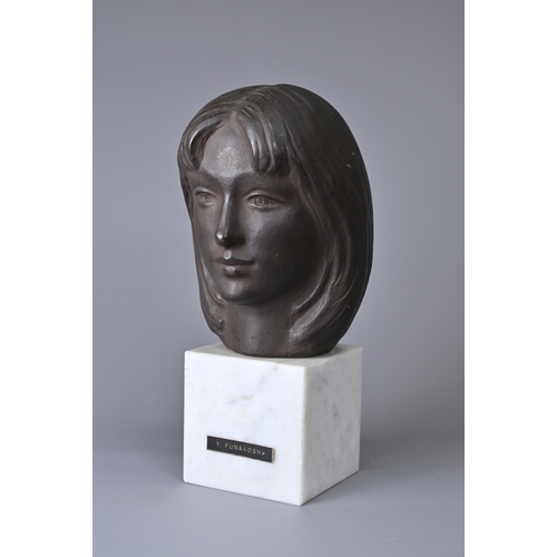 303 - A JAPANESE BRONZE BUST OF LADY K ON A WHITE MARBLE PLINTH BASE AFTER YASUTAKE FUNAKOSHI (1912-2002).... 