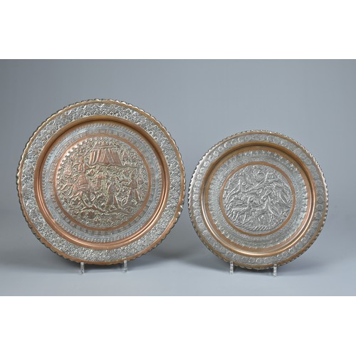 304 - TWO MIDDLE EASTERN TINNED COPPER DISHES, 20TH CENTURY. The first decorated in low relief with deer i... 