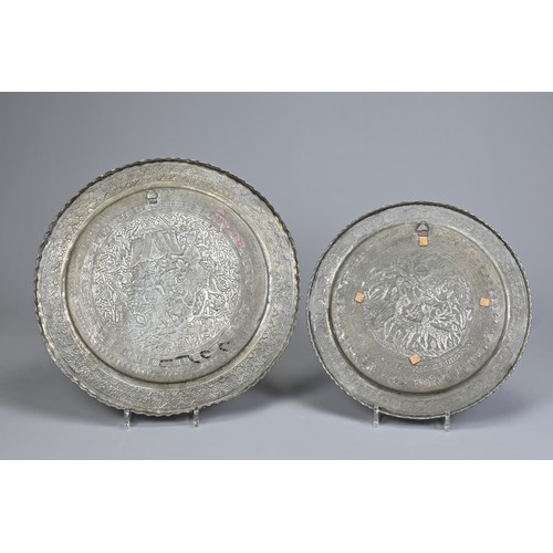 304 - TWO MIDDLE EASTERN TINNED COPPER DISHES, 20TH CENTURY. The first decorated in low relief with deer i... 