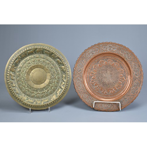 305 - FOUR INDO-PERSIAN BRASS AND COPPER DISHES, LATE 19TH/EARLY 20TH CENTURY. Comprising: a tinned copper... 