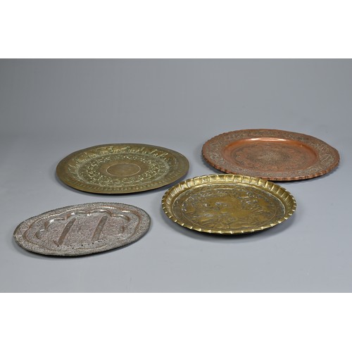 305 - FOUR INDO-PERSIAN BRASS AND COPPER DISHES, LATE 19TH/EARLY 20TH CENTURY. Comprising: a tinned copper... 