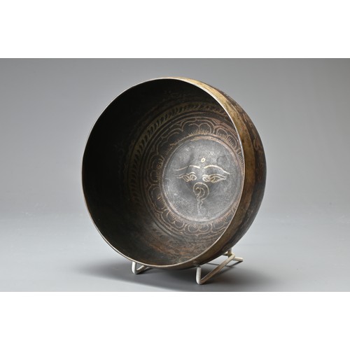 182 - TWO CHINESE TIBETAN BRONZE ITEMS. To include a singing bowl with banded decoration and Tibetan scrip... 