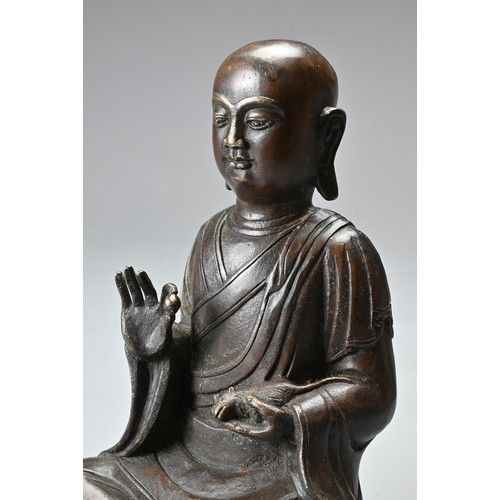 182 - TWO CHINESE TIBETAN BRONZE ITEMS. To include a singing bowl with banded decoration and Tibetan scrip... 