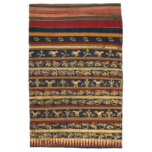 297 - AN INDONESIAN SUMATRAN LAMPUNG CEREMONIAL GOLD THREAD TAPIS SARONG, EARLY 20TH CENTURY. Embroidered ... 