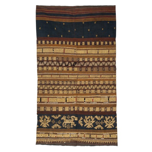 316 - AN INDONESIAN SUMATRAN LAMPUNG CEREMONIAL GOLD THREAD TAPIS SARONG, EARLY 20TH CENTURY. Embroidered ... 