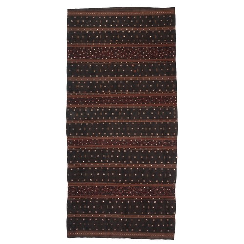 327 - AN INDONESIAN SUMATRAN LAMPUNG CEREMONIAL TAPIS SARONG, EARLY 20TH CENTURY. Embroidered with dark re... 