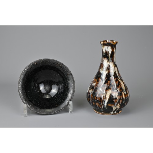 164 - TWO CHINESE CERAMIC ITEMS. To include a Cizhou type pear shaped bottle vase, covered in a black lust... 