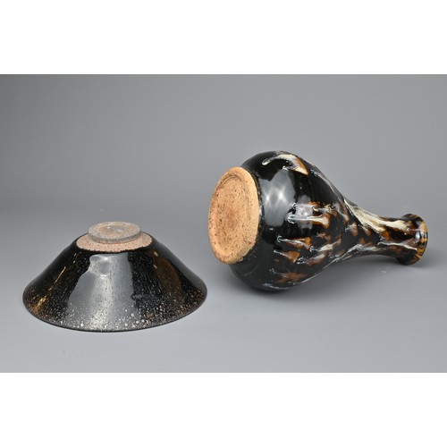 164 - TWO CHINESE CERAMIC ITEMS. To include a Cizhou type pear shaped bottle vase, covered in a black lust... 