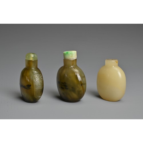 4 - THREE CHINESE GLASS IMITATION AGATE SNUFF BOTTLES. Each of flattened globular ovoid form, one with t... 