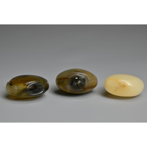 4 - THREE CHINESE GLASS IMITATION AGATE SNUFF BOTTLES. Each of flattened globular ovoid form, one with t... 