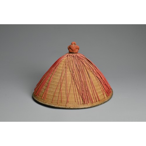 87 - A CHINESE MANDARIN SUMMER COURT HAT WITH CORAL FINIAL, QING DYNASTY. Of conical form with woven bamb... 