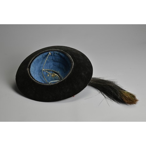 88 - A CHINESE MANDARIN WINTER COURT HAT WITH BLUE GLASS FINAL, QING DYNASTY. Covered in a black velvet w... 